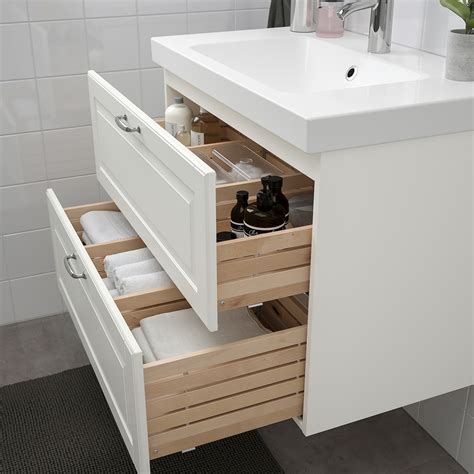 Ikea bathroom furniture - Bathrooms for every style and budget. A white NYSJÖN wash-basin cabinet with one door with a mirror above it,.